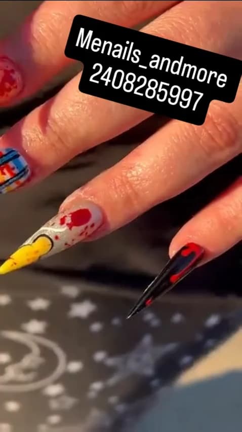 Close-up red and black long nail art from the Me Nails and More Instagram reel